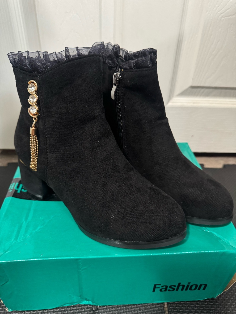 Women Black Ruffle-Trim Suede Ankle Booties with Gold Tassel Accent